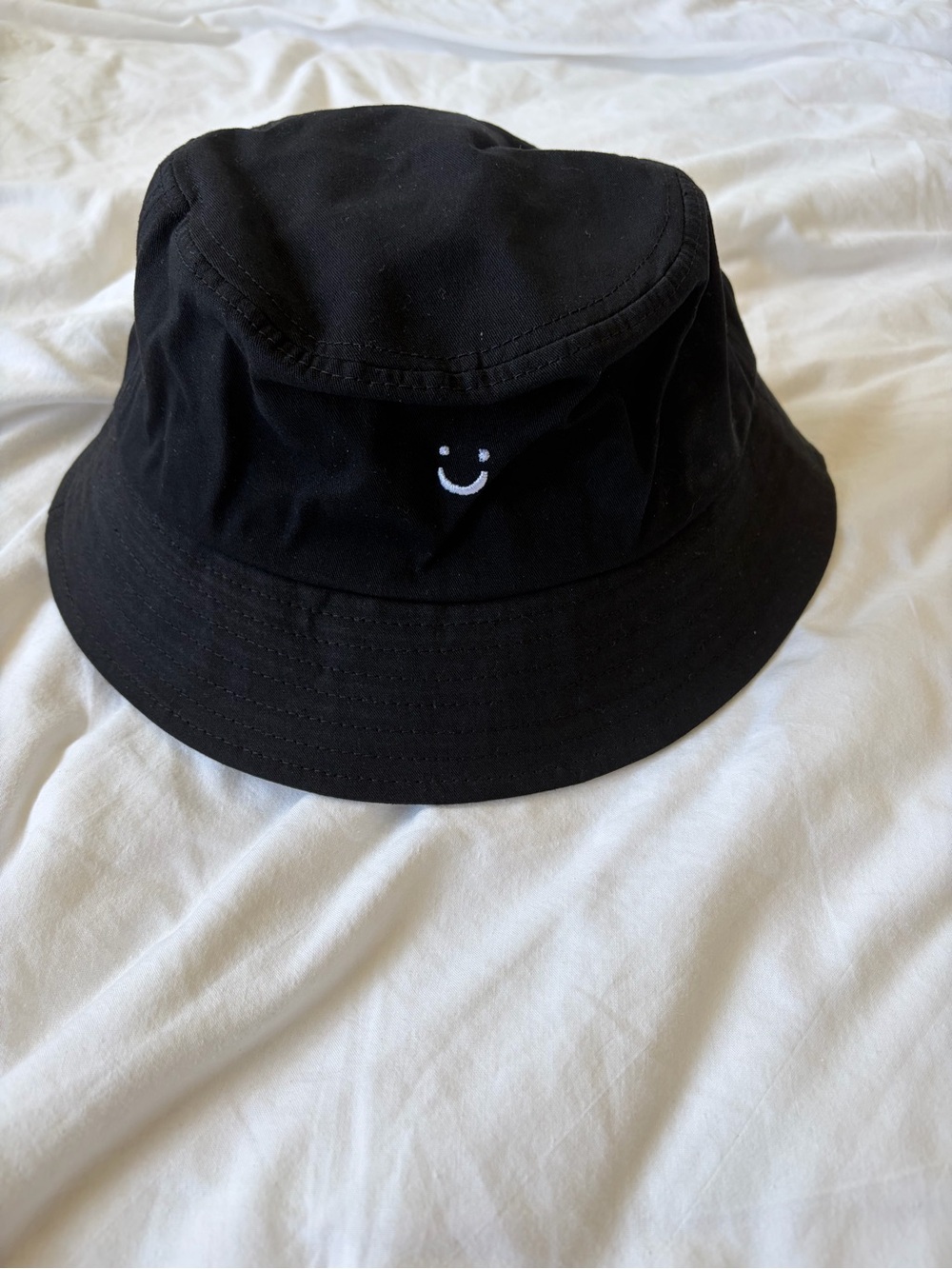 Black Bucket Hat with Small White Smile Embroidery